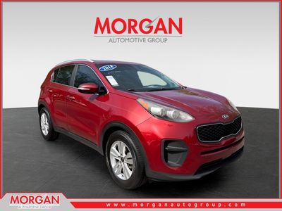 2018 Kia Sportage LX in Red — front three-quarter view