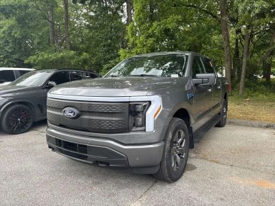2024 Ford F-150 Lightning — rear three-quarter view