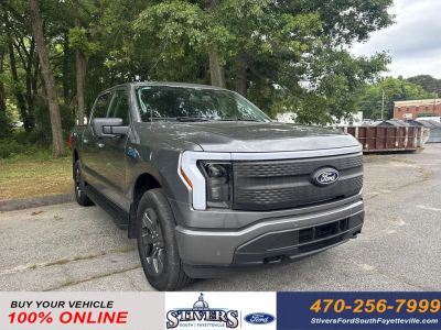2024 Ford F-150 Lightning Flash in Gray — front three-quarter view