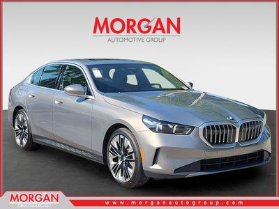 2026 BMW 5 Series 530i in Oxide Grey Metallic — front three-quarter view