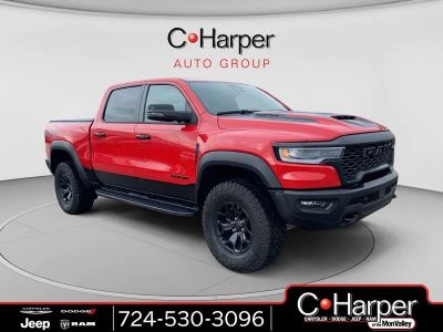 2025 RAM 1500 RHO in Flame Red Clearcoat — front three-quarter view