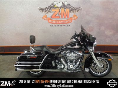 2013 Harley-Davidson Electra Glide Classic FLHTC in Vivid Black — front three-quarter view