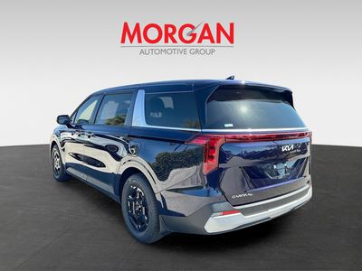 2026 Kia Carnival — rear three-quarter view