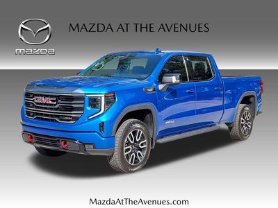 2022 GMC Sierra 1500 AT4 in Blue — front three-quarter view