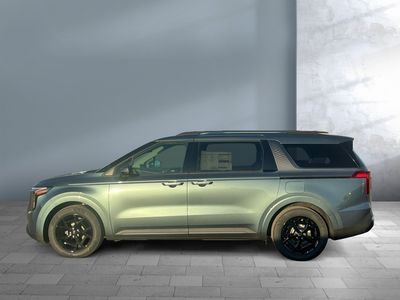 2026 Kia Carnival Hybrid — rear three-quarter view