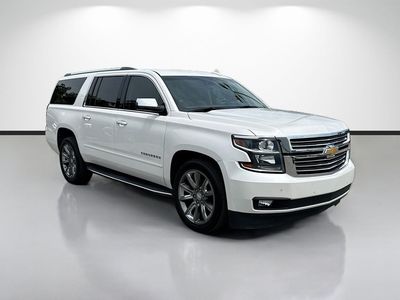 2019 Chevrolet Suburban Premier in Beige — front three-quarter view