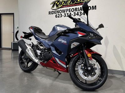 2026 Kawasaki Ninja 500 ABS Metallic Matte Twilight Blue in METALLIC MATTE TWILIGHT BLUE / CANDY PERSIMMON RED — front three-quarter view