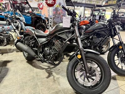2025 Honda Rebel 300 CMX300 in Matte Black Metallic — front three-quarter view