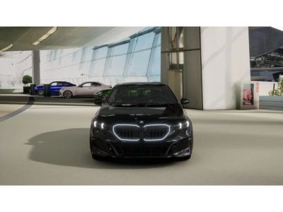 2027 BMW 5 Series — rear three-quarter view