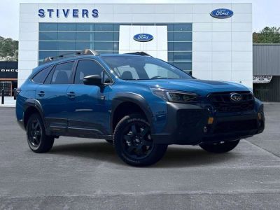 2025 Subaru Outback Wilderness in Geyser Blue — front three-quarter view
