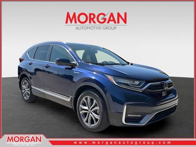 2021 Honda CR-V Hybrid Touring in Obsidian Blue Pearl — front three-quarter view