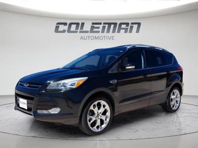 2013 Ford Escape Titanium in Tuxedo Black Metallic — front three-quarter view