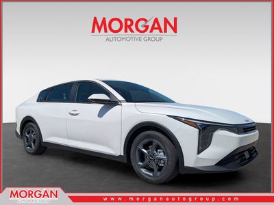 2026 Kia K4 LXS in Snow White Pearl — front three-quarter view