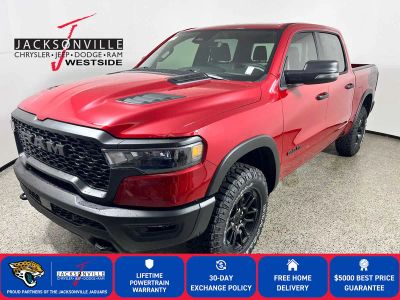 2026 RAM 1500 Rebel in Molten Red Pearl-Coat Exterior Paint — front three-quarter view