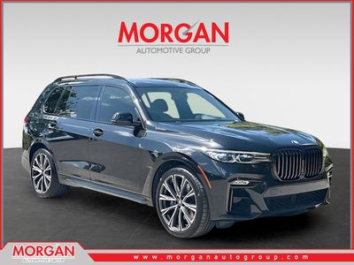 2021 BMW X7 M50i in Black Sapphire Metallic — front three-quarter view