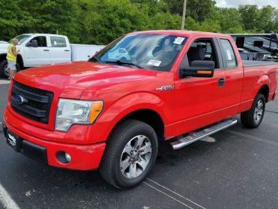 2013 Ford F-150 STX in Red — front three-quarter view
