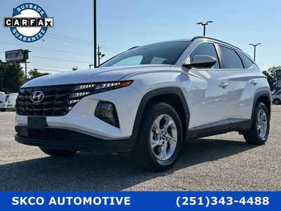2024 Hyundai Tucson in White Pearl — front three-quarter view