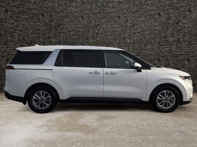 2024 Kia Carnival MPV — rear three-quarter view