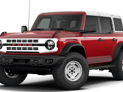 2026 Ford Bronco Heritage Edition in Ruby Red Metallic Tinted Clearcoat — front three-quarter view