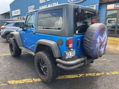 2015 Jeep Wrangler — rear three-quarter view
