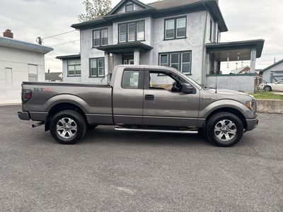 2013 Ford F-150 — rear three-quarter view