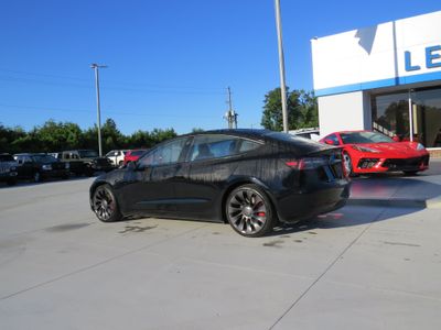 2023 Tesla Model 3 — rear three-quarter view