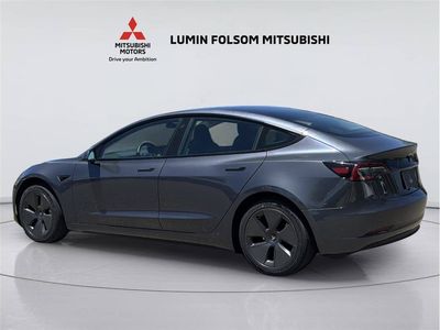 2023 Tesla Model 3 — rear three-quarter view