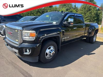 2016 GMC Sierra Denali in Onyx Black — front three-quarter view