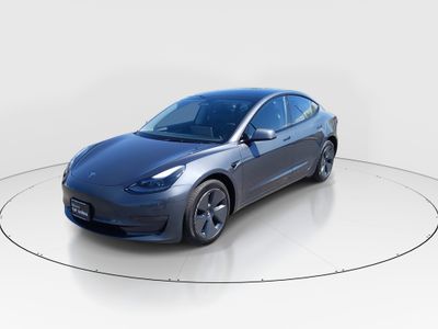2023 Tesla Model 3 — rear three-quarter view