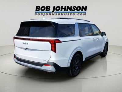 2026 Kia Carnival — rear three-quarter view