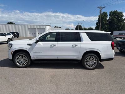 2026 GMC Yukon XL — rear three-quarter view