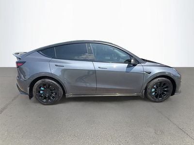2023 Tesla Model Y — rear three-quarter view
