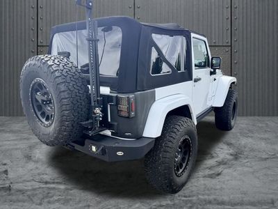 2015 Jeep Wrangler — rear three-quarter view