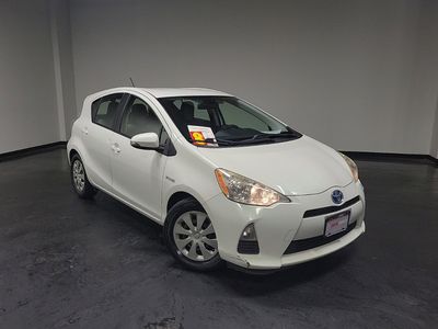 2014 Toyota Prius c — rear three-quarter view