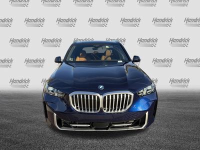 2026 BMW X5 xDrive50e — rear three-quarter view