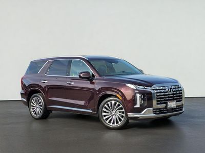 2024 Hyundai PALISADE CALLIGRAPHY in Sierra Burgundy — front three-quarter view