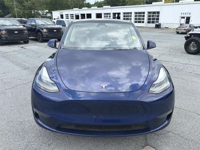 2024 Tesla Model Y — side profile view
