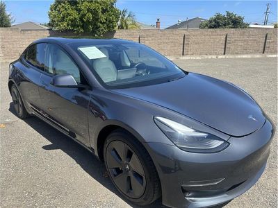 2021 Tesla Model 3 — rear three-quarter view