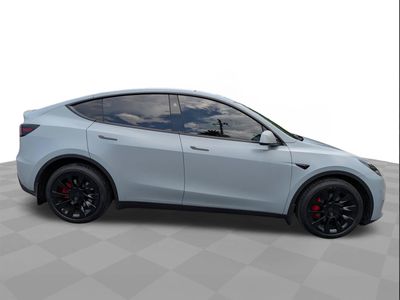 2023 Tesla Model Y — rear three-quarter view