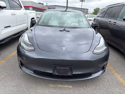 2023 Tesla Model 3 — rear three-quarter view