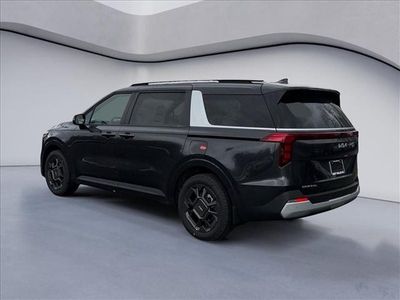 2026 Kia Carnival Hybrid — rear three-quarter view