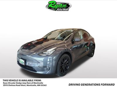 2023 Tesla Model Y Long Range in Midnight Silver Metallic — front three-quarter view