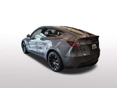 2023 Tesla Model Y — rear three-quarter view