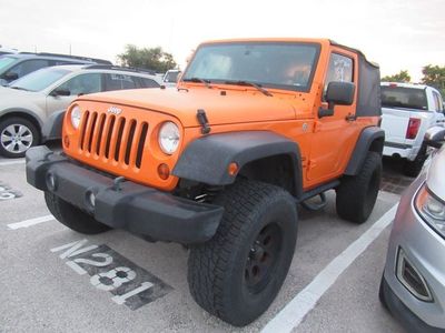 2013 Jeep Wrangler — rear three-quarter view