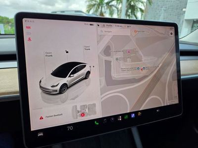 2023 Tesla Model 3 — side profile view