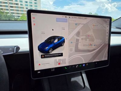 2023 Tesla Model Y — side profile view