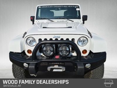 2013 Jeep Wrangler Unlimited — rear three-quarter view