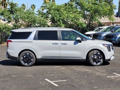 2026 Kia Carnival — rear three-quarter view