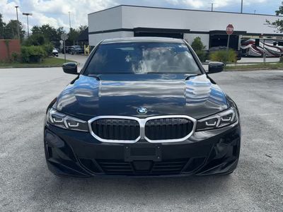 2025 BMW 330i — rear three-quarter view