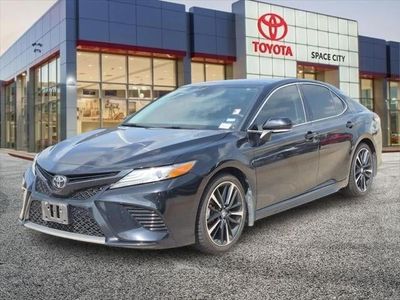 2019 Toyota Camry — rear three-quarter view